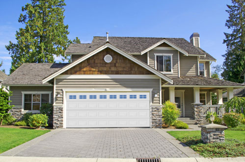 Door giveaway A home with a newly installed garage door.